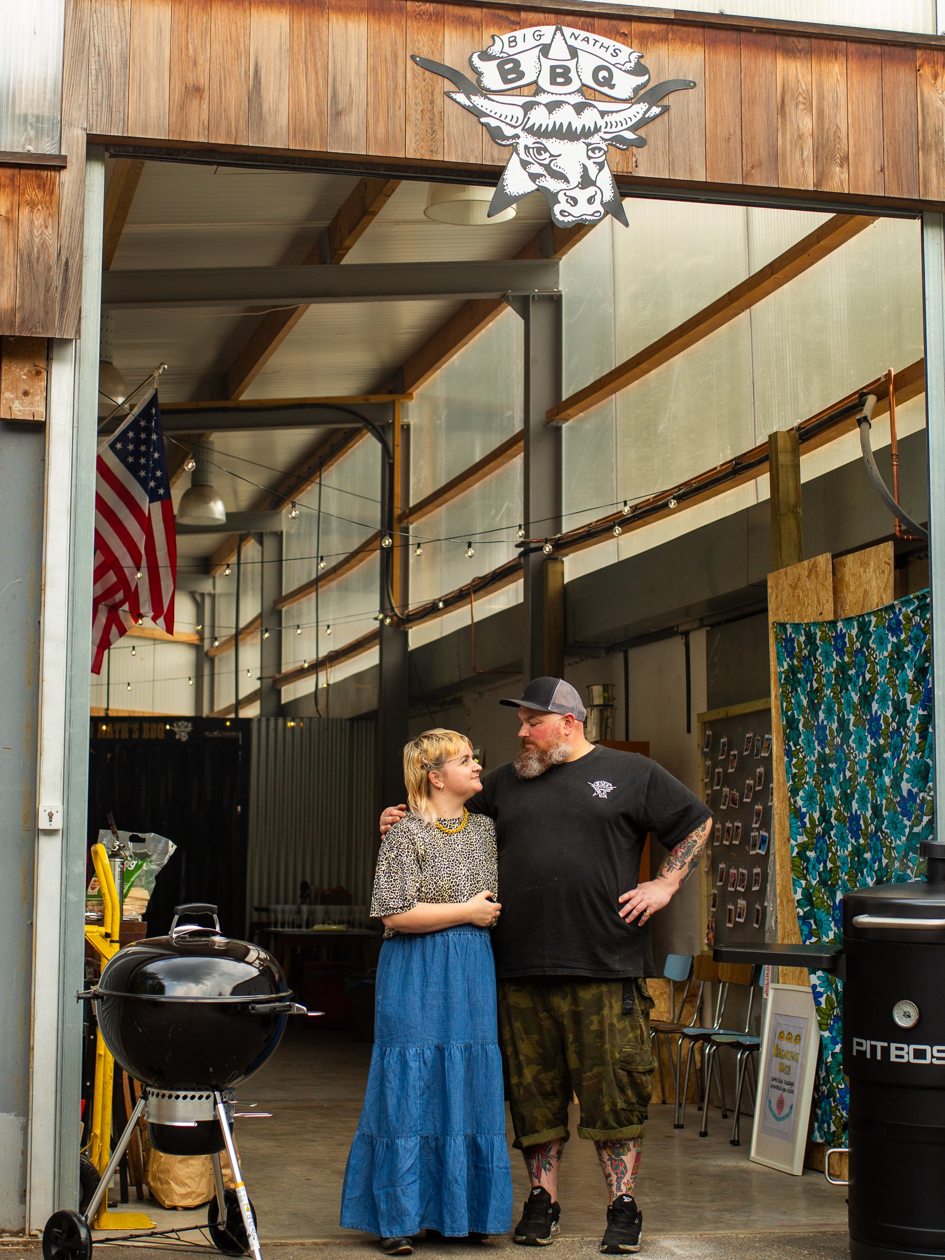 Big Nath and Kins standing together in front of BBQ HQ 
